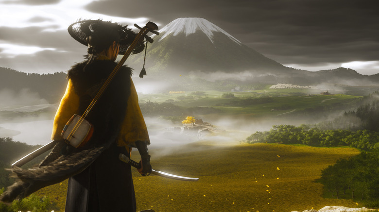 Atsu stands observing Mount Fuji in Ghost of Yōtei