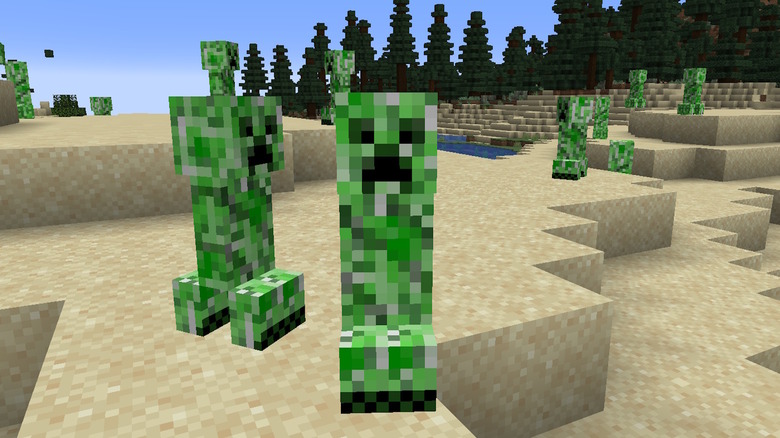 Multiple Creepers in a sandy area in Minecraft