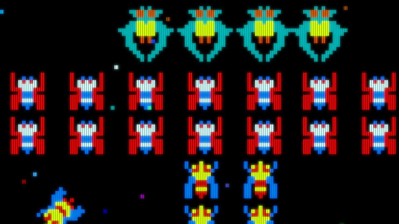 Rows of space bugs descend in Galaga