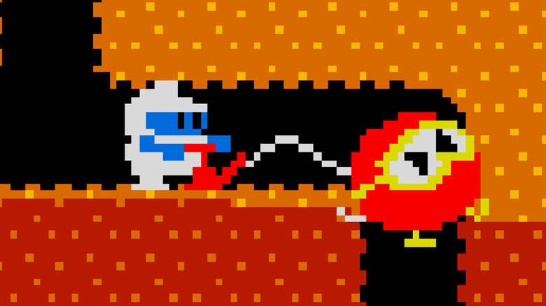 Dig Dug inflates an enemy with an air pump in Dig Dug