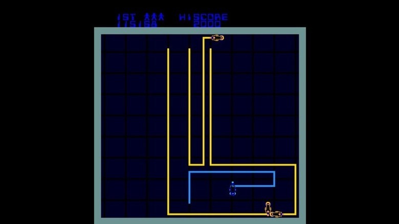 Blue and yellow light cycles try to outmaneuver each other in Tron (1982)