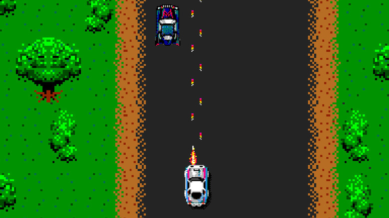A lightly colored car shoots a dark car on a road in Spy Hunter