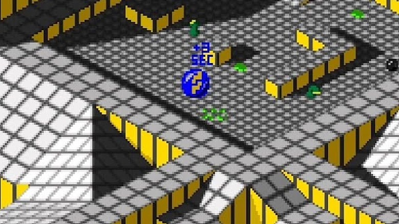 A blue marble rolls around a maze in "Marble Madness" (1984)