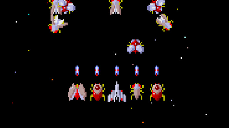 A row of spaceships fire at incoming enemies in Gaplus