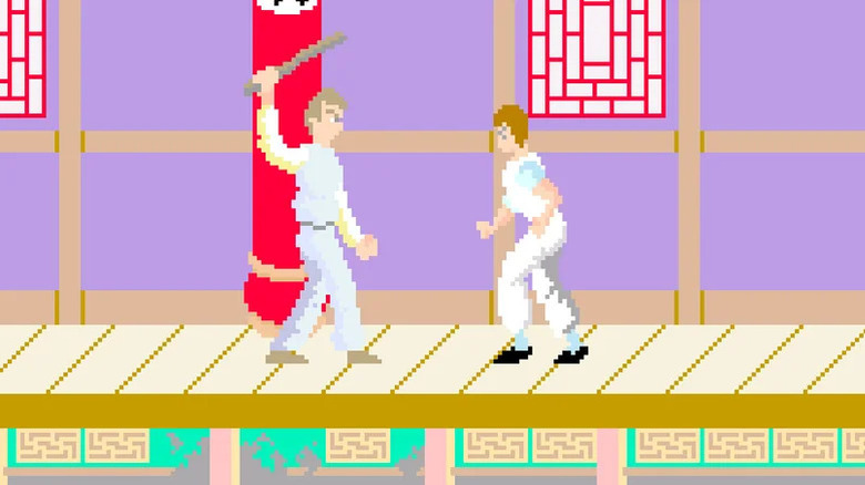 Thomas approaches a man swinging a club in Kung-Fu Master