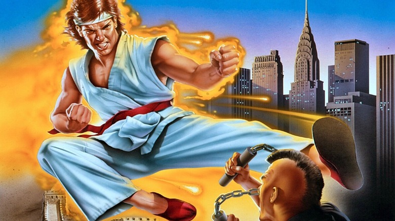 Ryu lunges at a crook with nunchaku on the PC cover art for "Street Fighter" (1987)