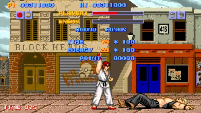 Ryu raises his fist over a defeated Birdie in "Street Fighter" (1987)