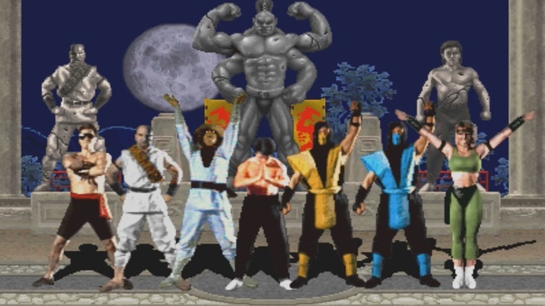 The playable roster of Mortal Kombat pose in front of statues in the end credits screen of Mortal Kombat (1992)