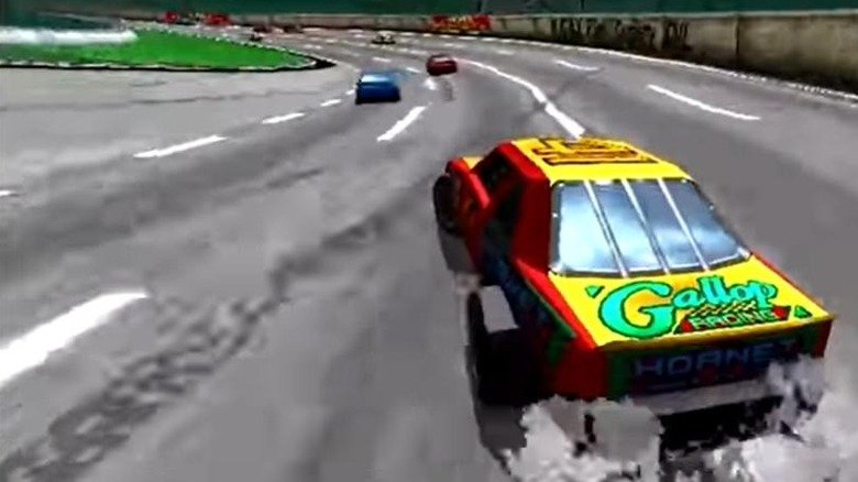 A yellow and red car drifts heading into a turn in Daytona USA