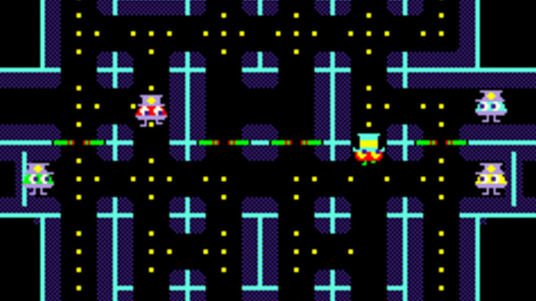 A player runs through a maze collecting gold coins while pursued by police in "Lock 'n' Chase" (1981)