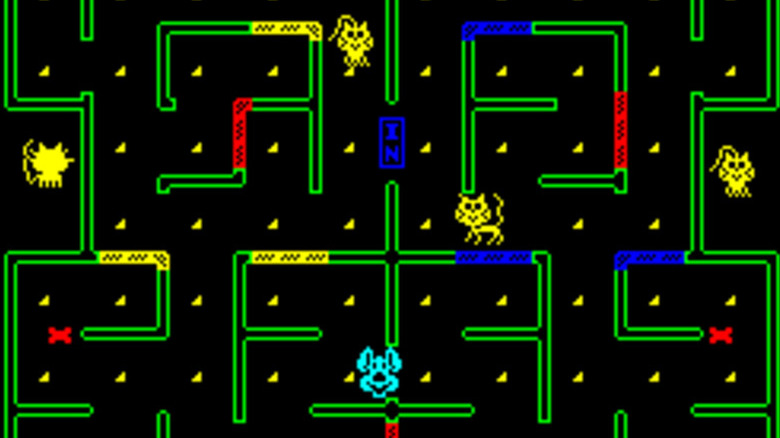 A dog collect pieces of cheese with four cats above it in "Mouse Trap" (1981)