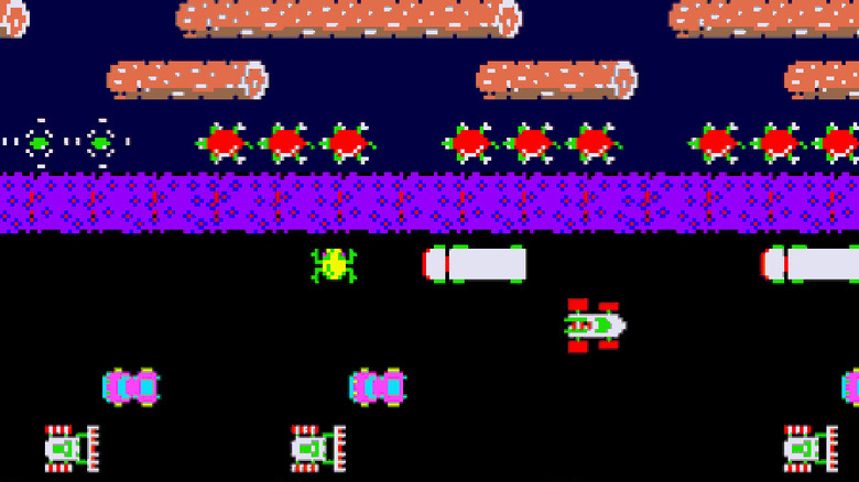 A frog moves across a highway towards a creek in Frogger