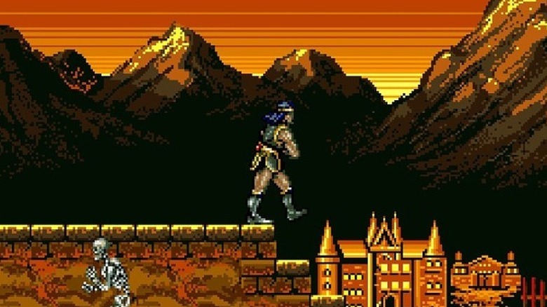 Simon Belmont walks on a platform with the mountains and a castle in the background in Haunted Castle
