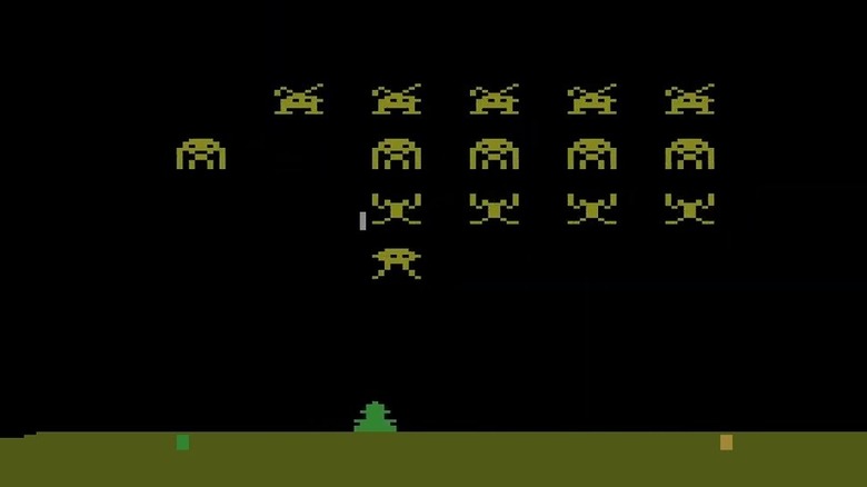 A laser cannon fires at descending extraterrestrials in Space Invaders