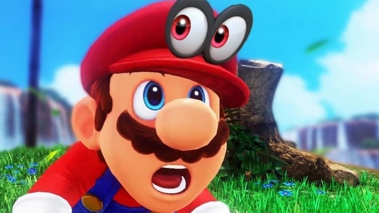 Mario stares up at Cappy on his head in Super Mario Odyssey