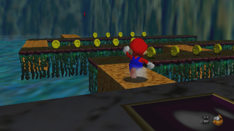 Mario runs across platforms over water in Super Mario 64