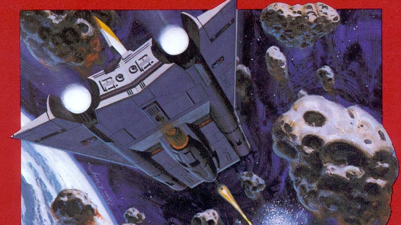 A spaceship fires at incoming asteroids on the cover art for Asteroids
