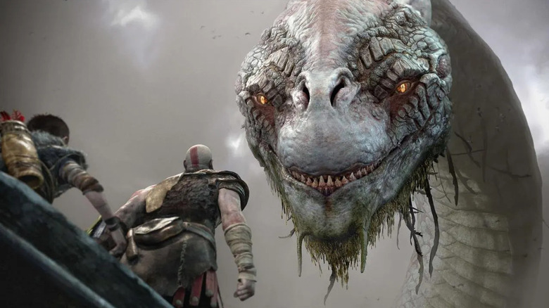 Atreus and Kratos face a large serpent in God of War (2018)