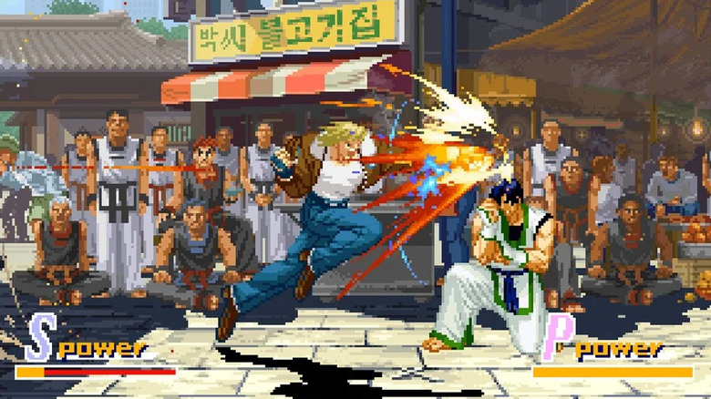 Terry Bogard lunges at a blocking Kim Jae-hoon in Garou: Mark of the Wolves