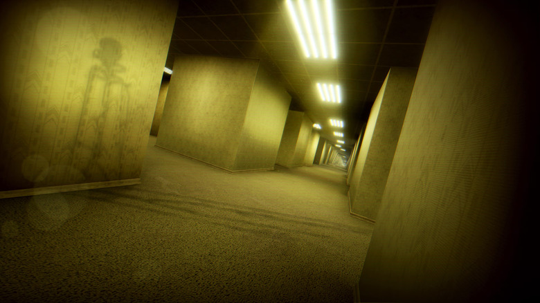 The shadow of an otherworldly being is seen in backrooms bathed in sickly yellow light in Escape the Backrooms