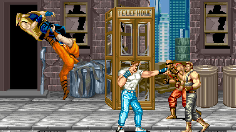 Guy kicks an enemy while Cody punches two incoming goons in Final Fight