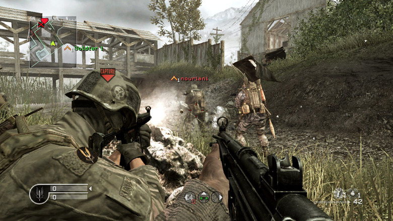 A squad marches on a riverbank with a flag in Call of Duty 4: Modern Warfare