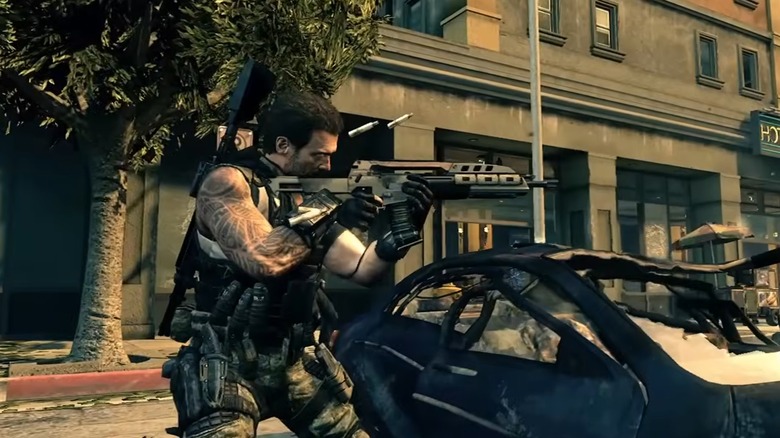 An operator in Black Ops 2 firing at an enemy on the streets of Los Angeles