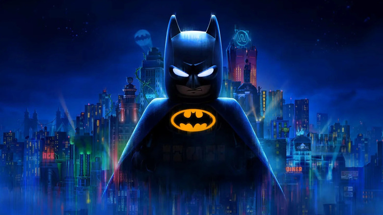 LEGO Batman glares over the Gotham City skyline on the cover art for LEGO Batman: Legacy of the Dark Knight