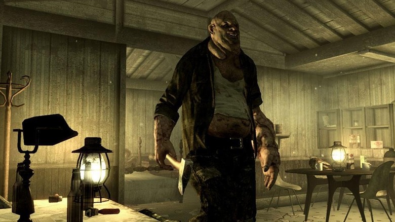 A mutant holds an ax in a dingy cabin in Fallout 3