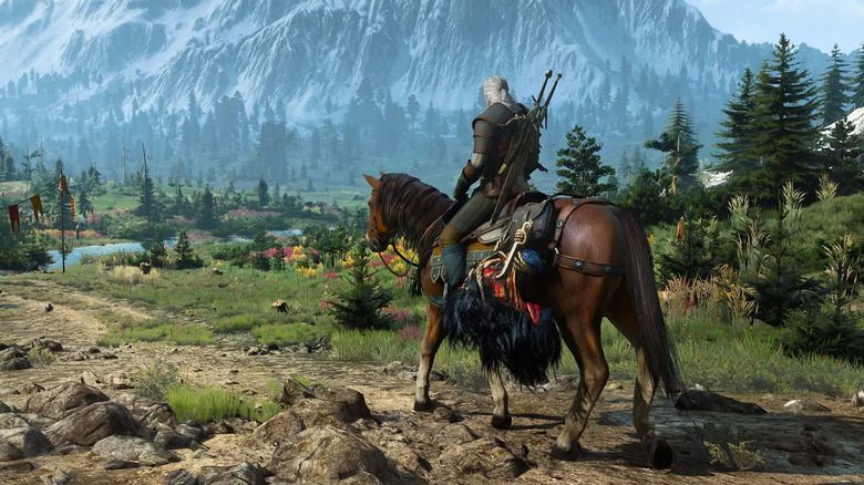 Geralt of Rivia rides a horse across a scenic countryside in "The Witcher 3: Wild Hunt" (2015)
