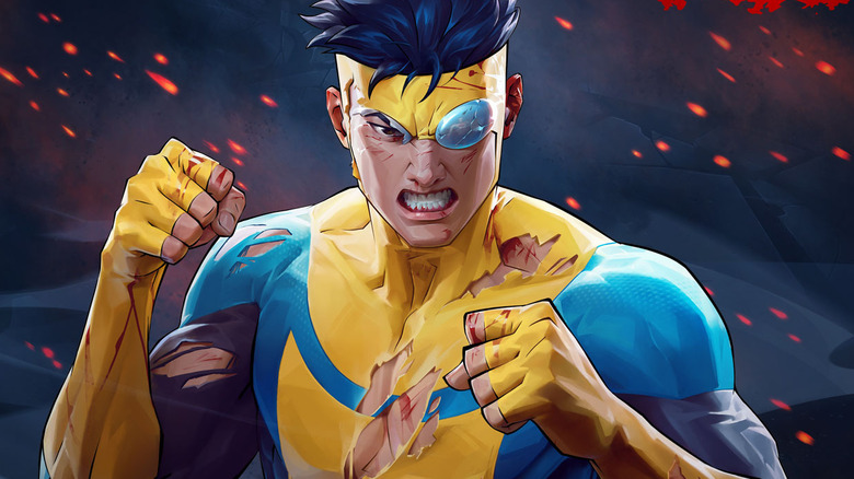 A battle-damaged Invincible stands ready to fight on the cover art for Invincible VS
