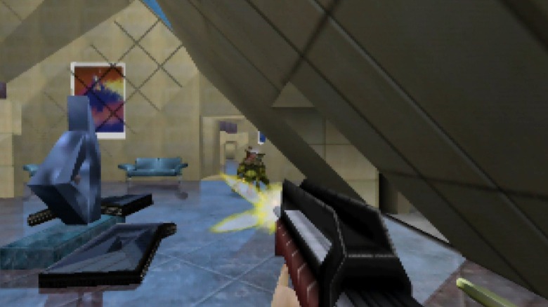 Joanna Dark fires an assault rifle at a Skedar in Perfect Dark