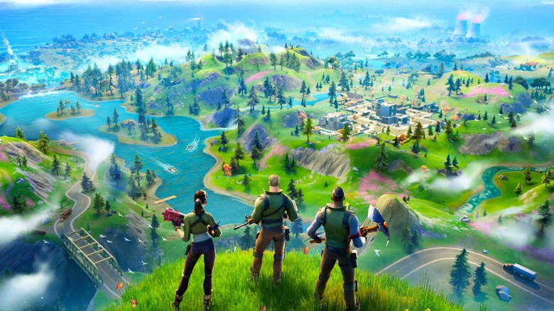 Fortnite characters standing on a hill overlooking the map