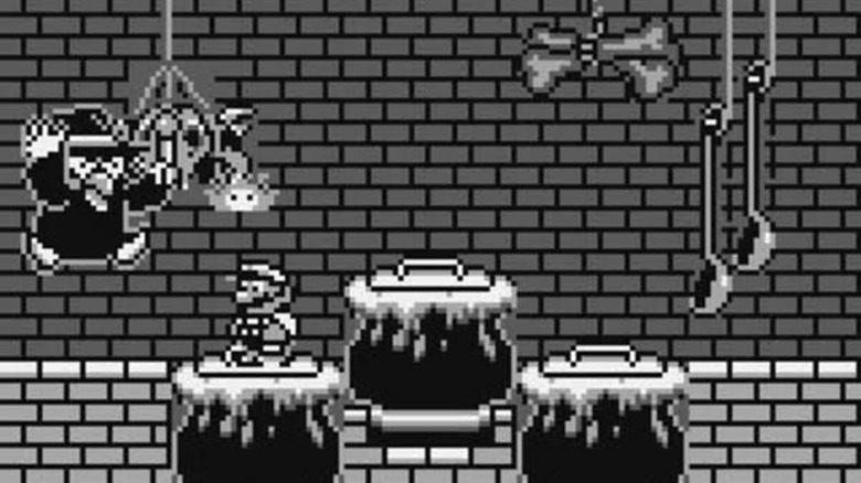 Mario confronts a witch while standing on a cauldron in Super Mario 2: 6 Golden Coins