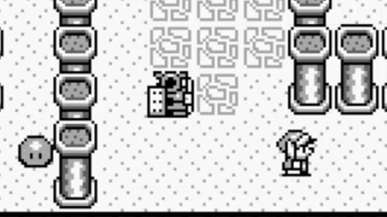 Link walks by columns with an armored statue behind him in The Legend of Zelda: Link's Awakening