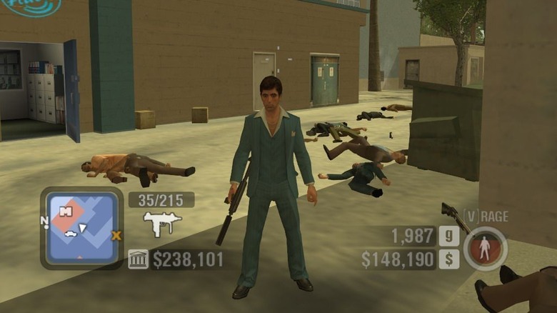 Tony stands in front of various dead bodies in a screenshot from Scarface: The World is Yours (2006)