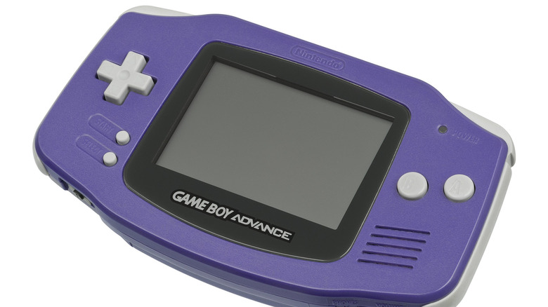 An indigo Game Boy Advance sits on a white background