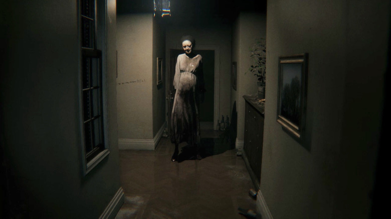 A ghostly woman stands in a hallway in P.T.