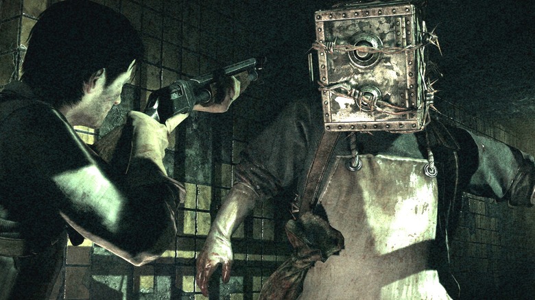 Sebastian aiming a shotgun at a man with a safe for a head in The Evil Within