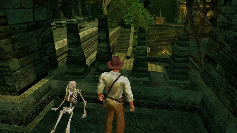 Indiana Jones surveys ancient ruins while standing next to a skeleton in Indiana Jones and the Emperor's Tomb