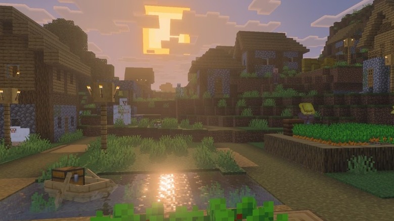 The sun sets on a small town in Minecraft