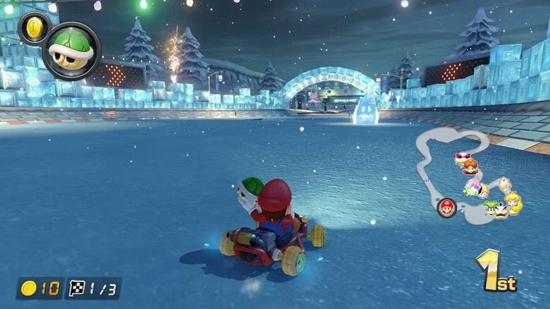 Mario readies a green turtle shell in Mario Kart 8 Deluxe