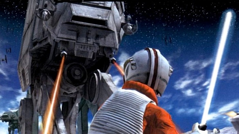 Luke Skywalker faces an AT-AT with his lightsaber drawn on the cover art for Star Wars Rogue Squadron III: Rebel Strike