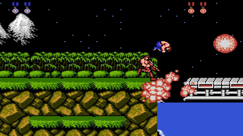 Bill and Lance blast a metal bridge over a river in "Contra" on the NES