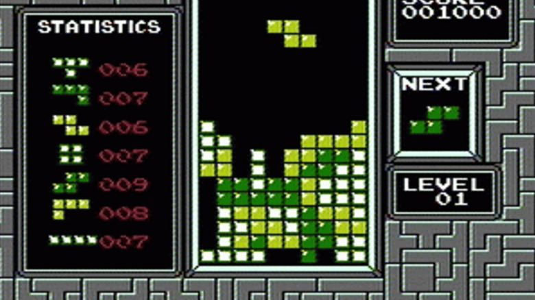 A green block descending in "Tetris" on the NES