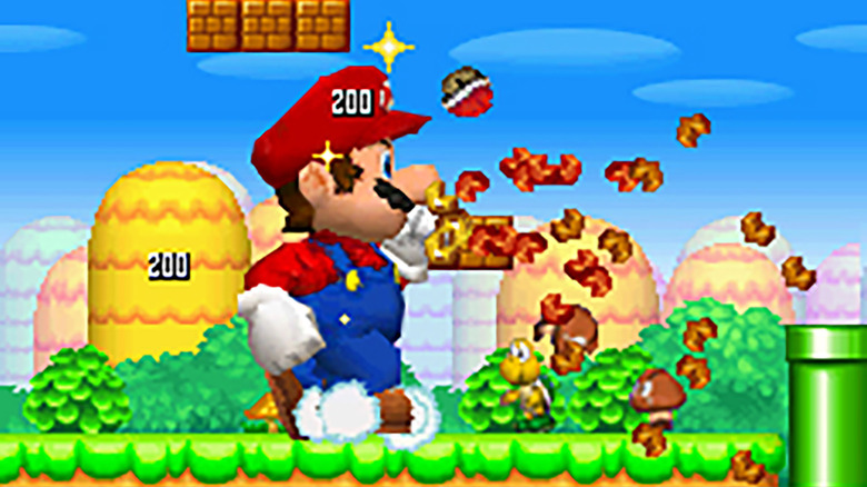 An enlarged Mario crushing blocks and turtle shells in New Super Mario Bros.
