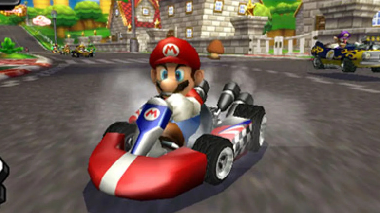 Mario slides around a corner in a go-kart in Mario Kart Wii