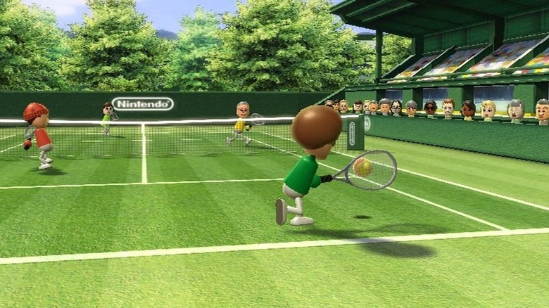 Four Miis play tennis on a grassy court in Wii Sports