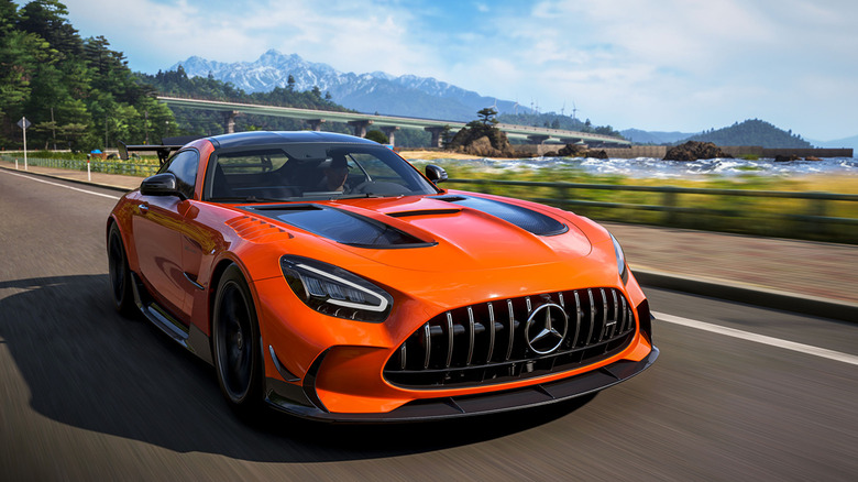 An orange Mercedes drives through the countryside in Forza Horizon 6
