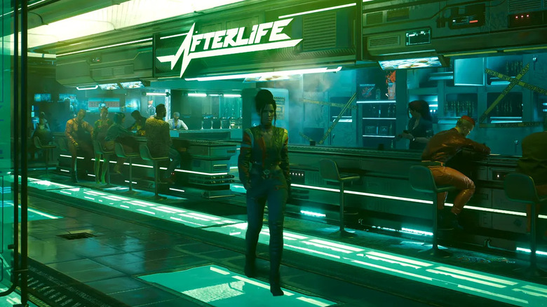A woman walks by the counter at Afterlife in Cyberpunk 2077
